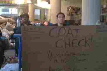 Protesters man the coat check in the UFT building at 52 Broadway